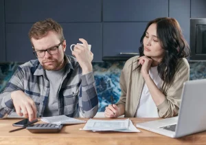 man and woman doing taxes