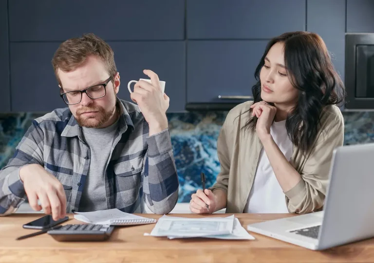 man and woman doing taxes