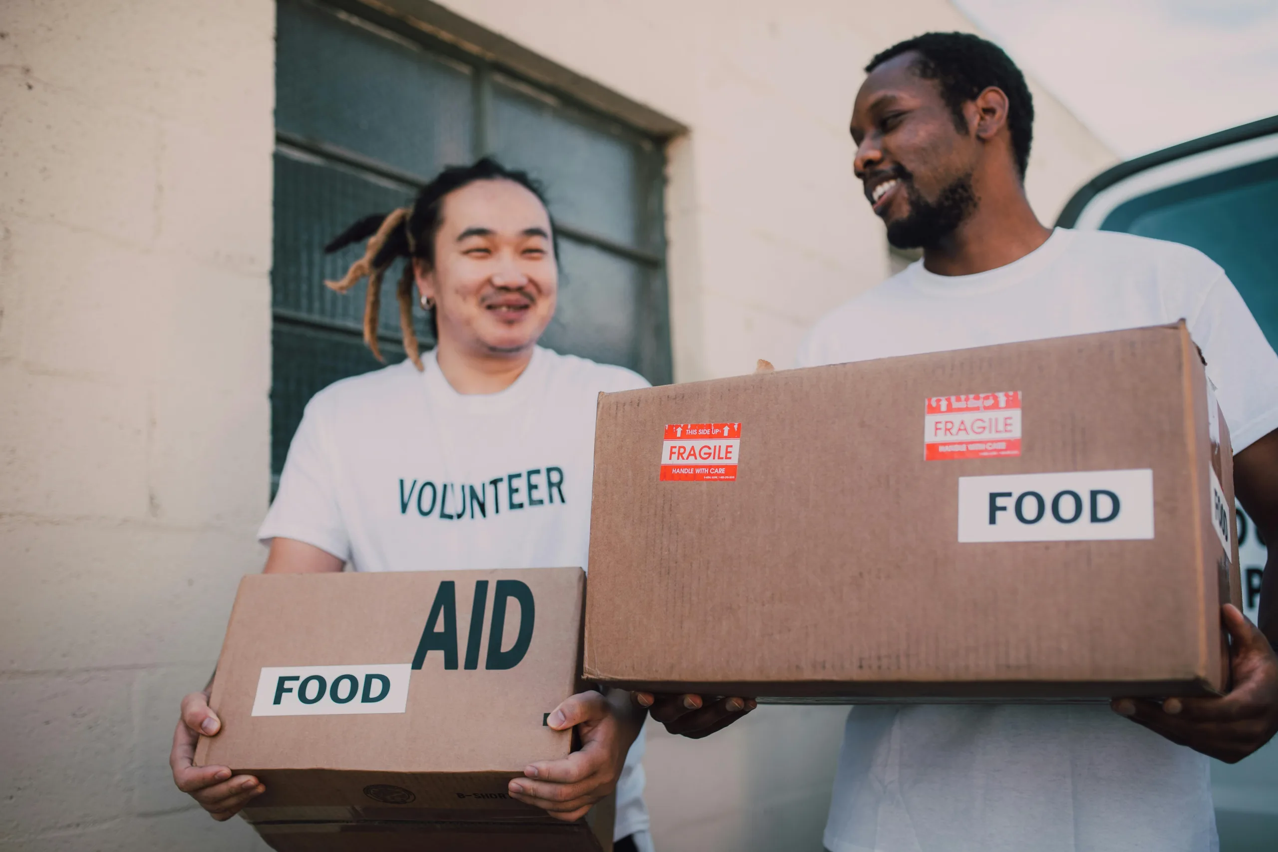 friends carrying boxes