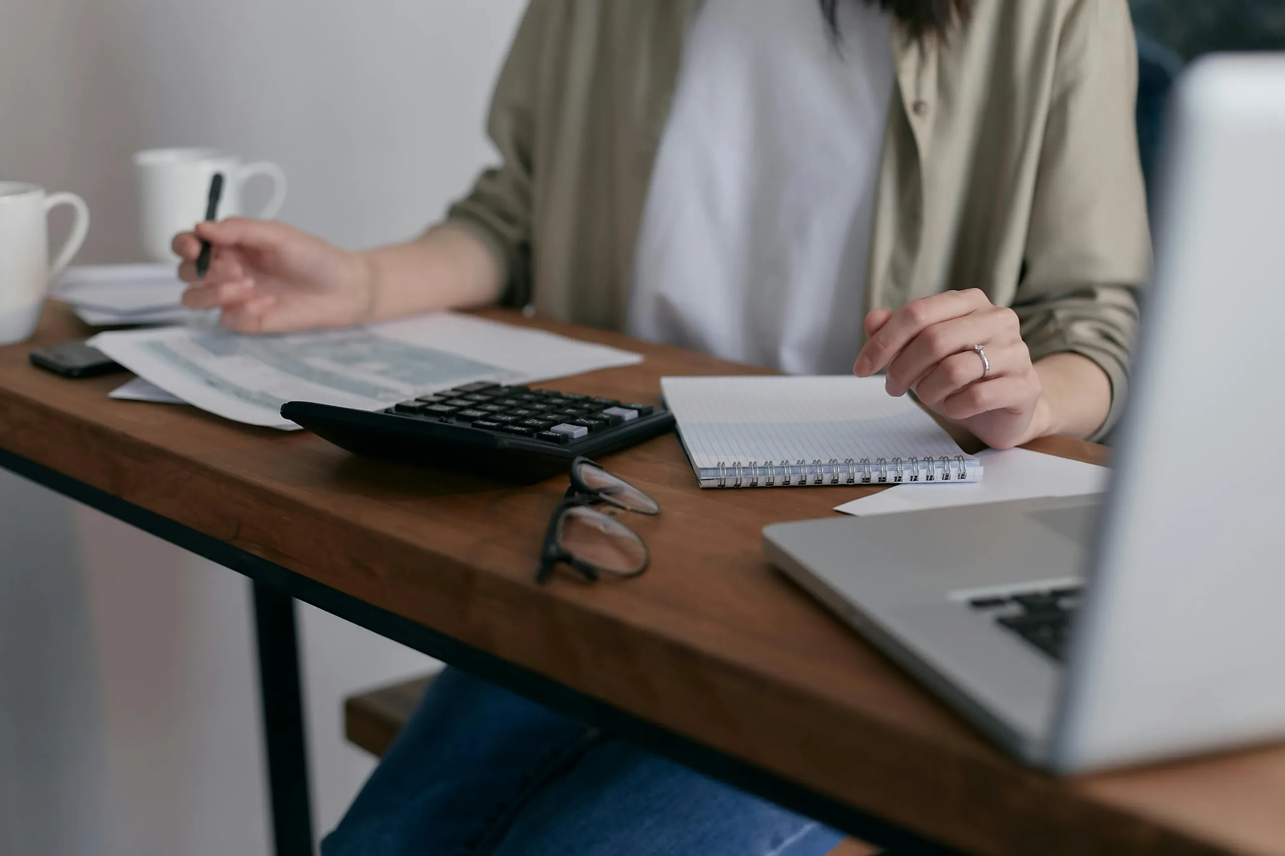 lady doing taxes at a desk 