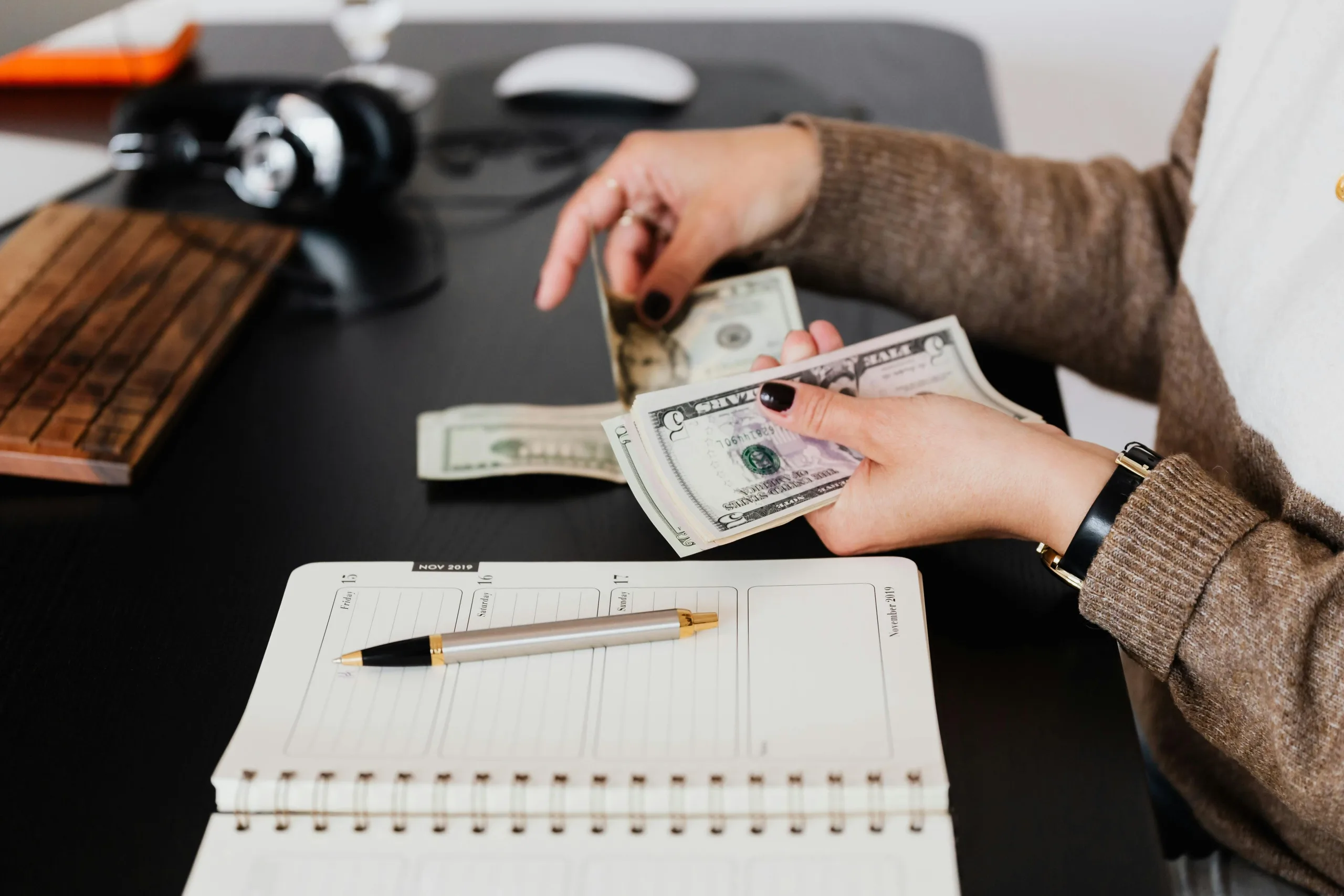 woman handing out cash