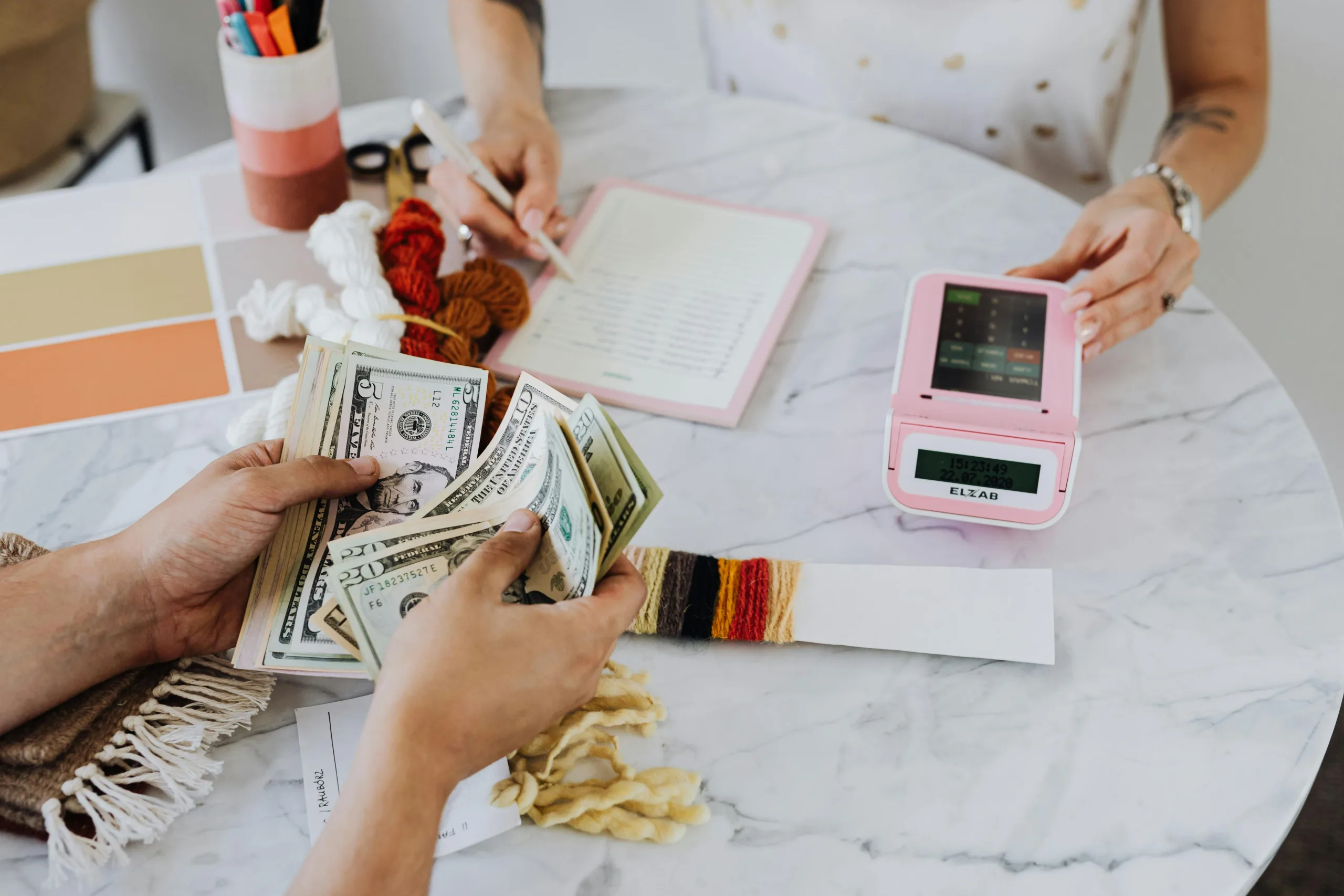 woman handing out cash