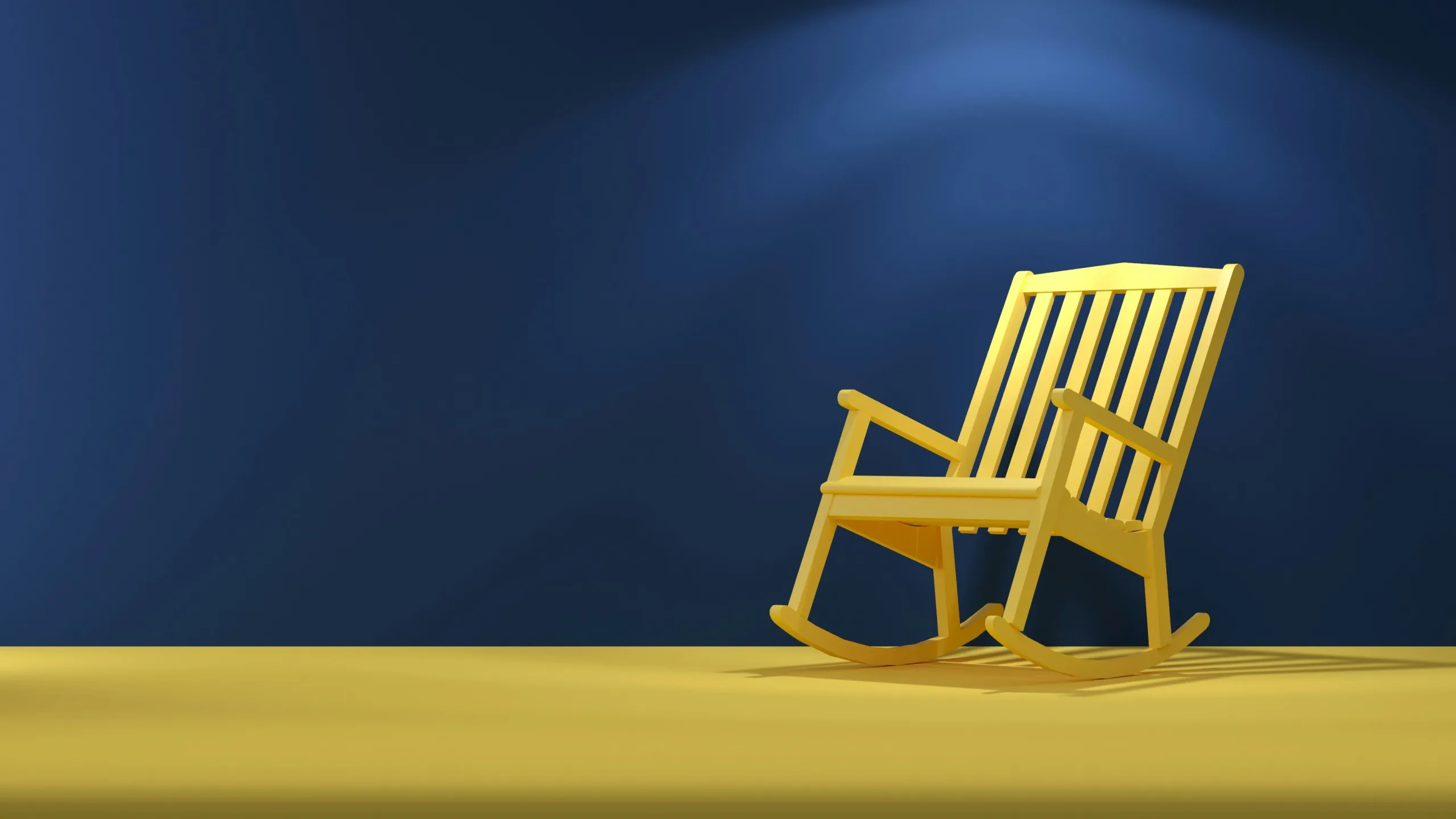 A rocking chair in front of a blue background.