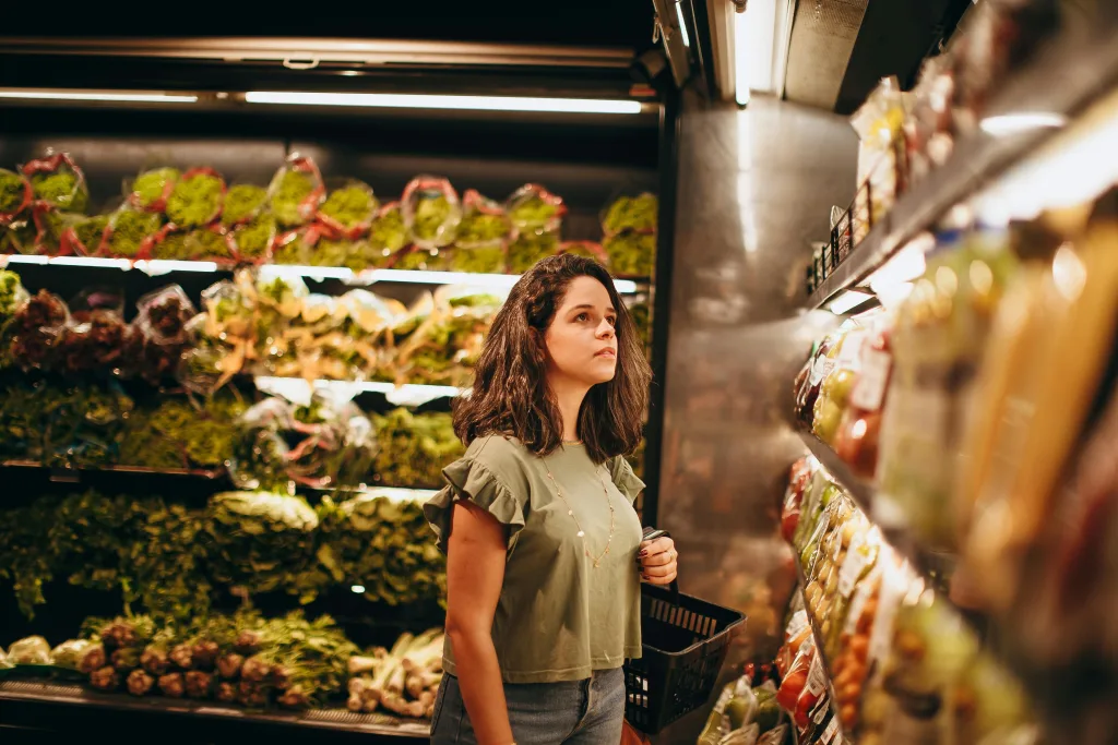 Someone shopping in a small grocery store.