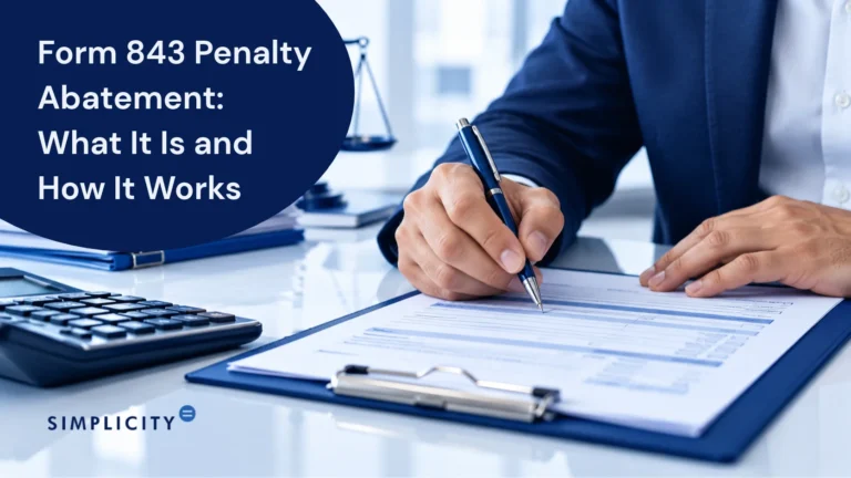 Image of person completing form 843 penalty abatement paperwork with pen